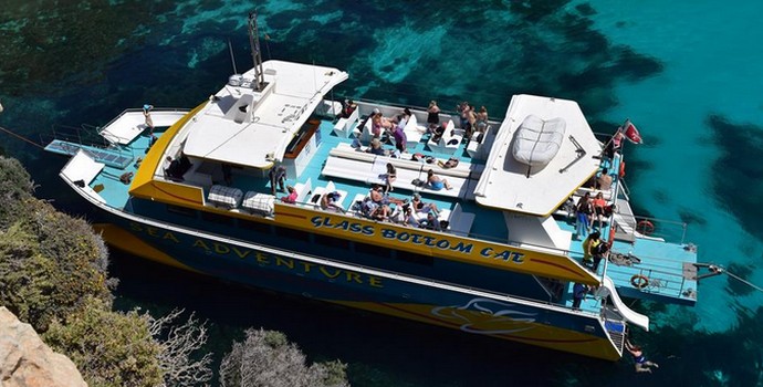 Comino, Blue Lagoon & the Caves on the Glass bottomed Catamaran by Sea Adventure Excursions